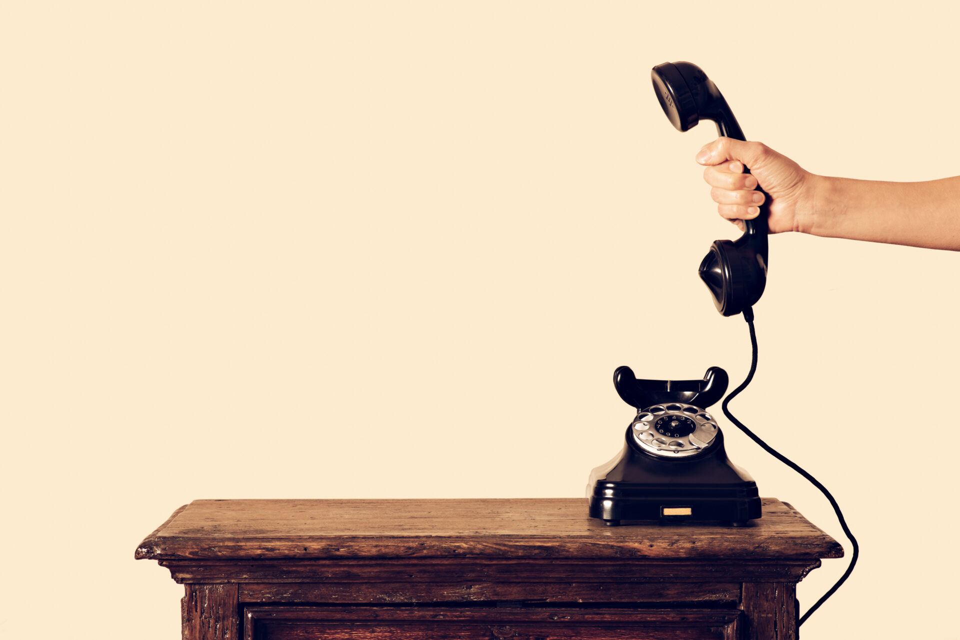 antique telephone receiver in hand held
